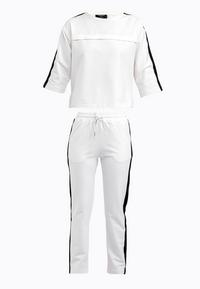 Tom Barron Trainingsanzug Damen - ecru
