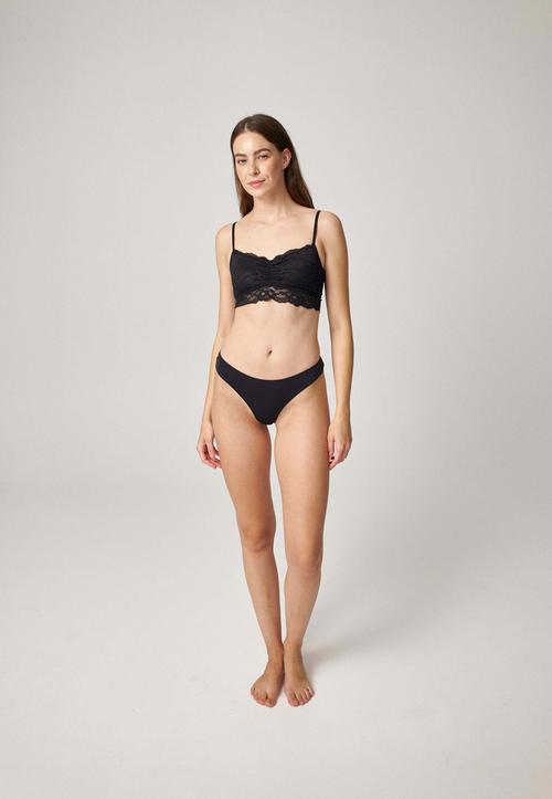Rückansicht von Snocks Seamless Tanga mit Spitze String Damen Schwarz